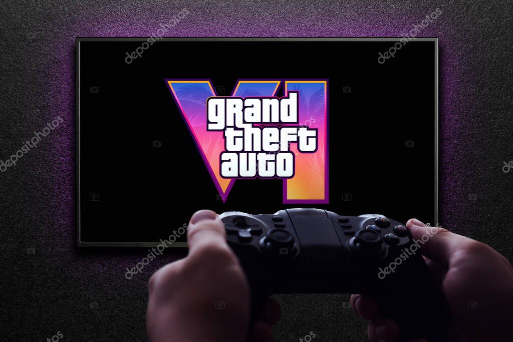 Grand Theft Auto 6 trailer game on TV screen with gamepad in hand on black textured wall with light. Astana, Kazakhstan - December 5, 2023.