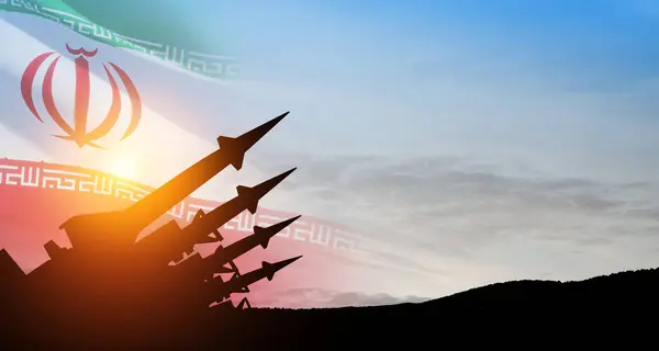 stock image The missiles are aimed at the sky at sunset with Iran flag. Bomb, chemical weapons, missile defense, a system of salvo fire.