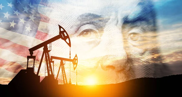Oil price cap concept. Petroleum, petrodollar and crude oil concept. Oil pump on background of US dollar and USA flag. Dollar and oil pumps