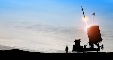 Israel's Iron Dome air defense missile launches. Silhouettes of soldier and Israel's Iron Dome air defense. The missiles are aimed at the sky at sunset. Missile defense. clipart