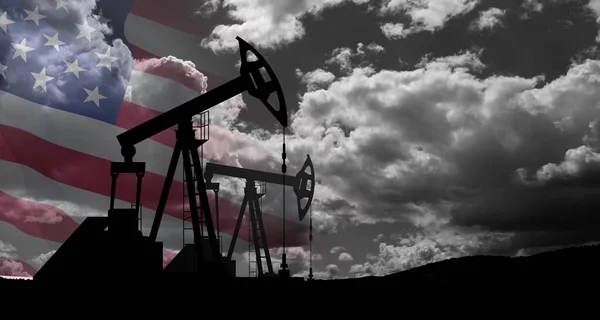The change in oil prices caused by the war. Oil price cap concept. Oil drilling derricks at desert oilfield with USA flag. Crude oil production from the ground. Petroleum production.
