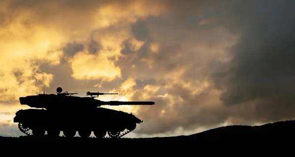Silhouette of army tank at sunset sky background. Military machinery.