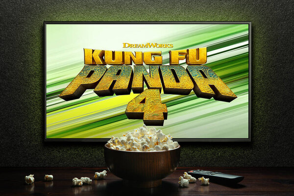 Kung Fu Panda 4 trailer or movie on TV screen. TV with remote control and popcorn bowl. Astana, Kazakhstan - March 22, 2024.