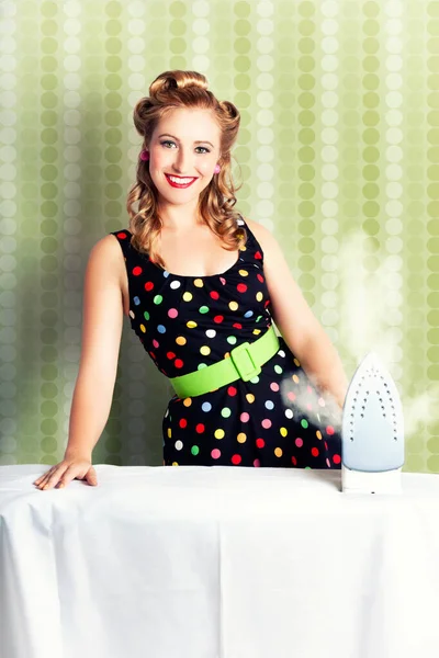 Fifties Classic Portrait Of A Retro House Work Woman Doing Home Choirs With A Old-Fashioned Steam Iron
