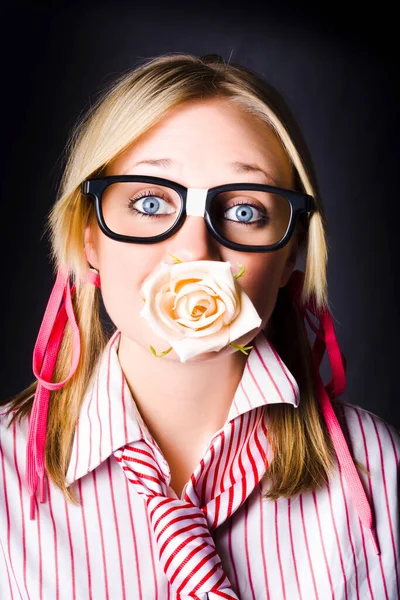 Silenced Nerd With Expression Of Admiration Holding Cream Rose Flower Bud In Mouth When Professing Untold Love