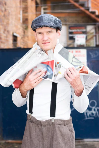 Over His Head In The Latest Fashion News A Fashionable Man Wears A Newspaper As A Victim Of Fashion