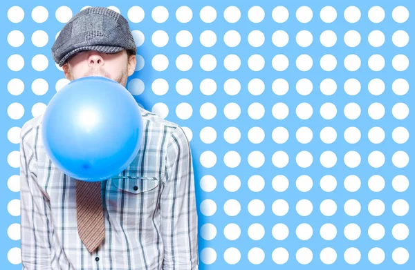 Retro Birthday Kid Blowing Up A Blue Party Balloon On Cute Polka Dot Card Background