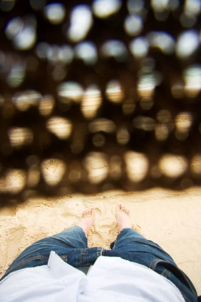 First Person Perspective Of A Man With A Straw Hat Covering His Eyes Lying Asleep At A Beachside Location
