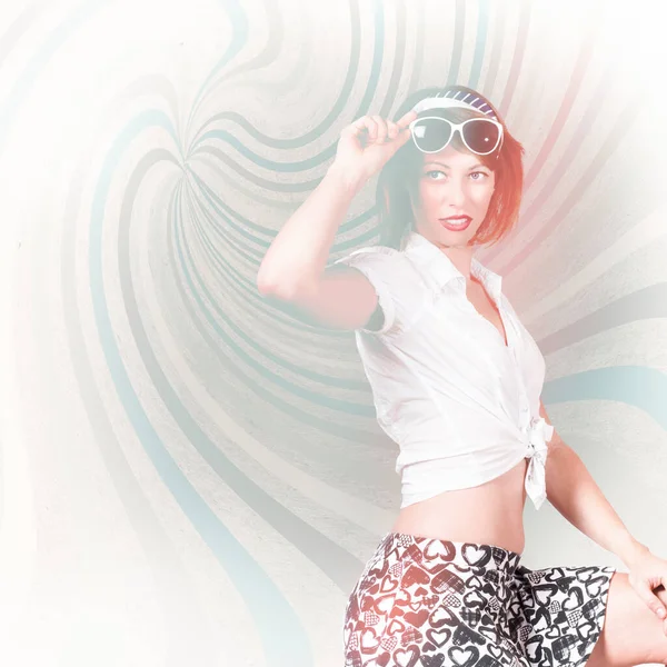 Bright high-key fashion photograph of a funky pinup girl on a retro swirl background. High-end fashion look