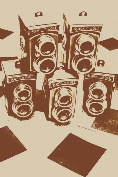 Vintage creative artwork on old twin lens camera icons over blank nostalgia instant film photos. Vintage snapshots and old cameras
