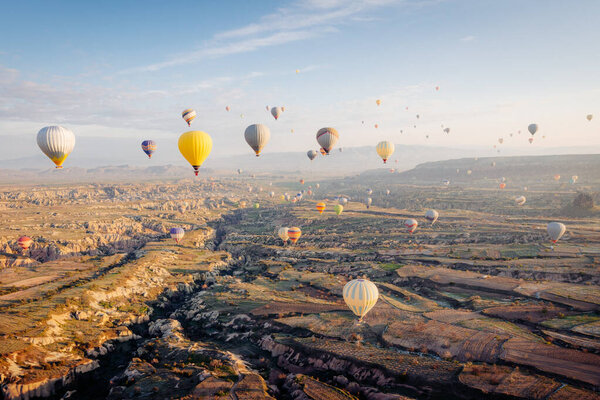 Hot air balloon flying over spectacular Cappadocia. High quality photo