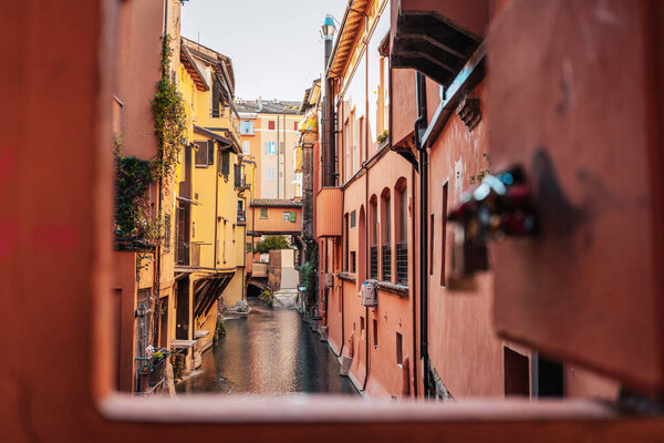 Bolognas canal, colorful buildings, and charming alleyways