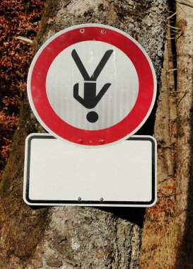 Traffic sign prohibition sign with a person standing on his head