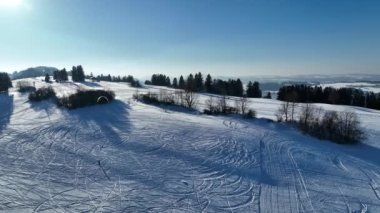 Drone video of a kitesurfer in winter in the snow. Snowkiting in the mountains