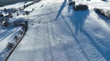 Drone video of a kitesurfer in winter in the snow. Snowkiting in the mountains