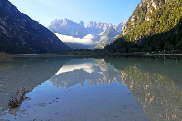 The mountains are reflected in the Duerrensee in the Dolomites in South Tirol