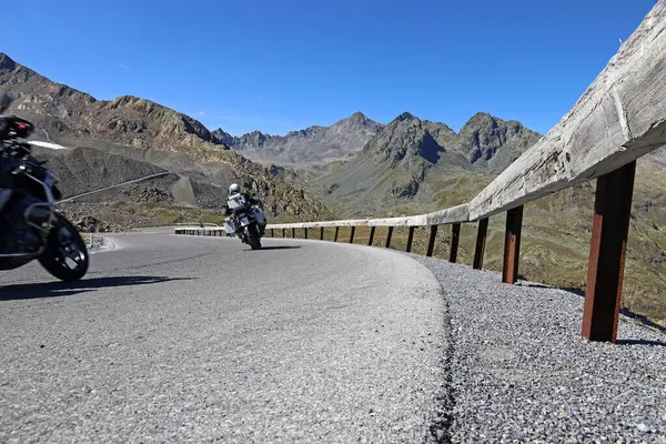 stock image Motorcycling in the mountains. Two motorcyclists on the pass road in the Kaunertal in Austria