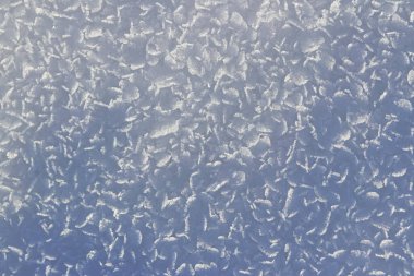 Close-up of snowflakes and ice crystals on the ground clipart