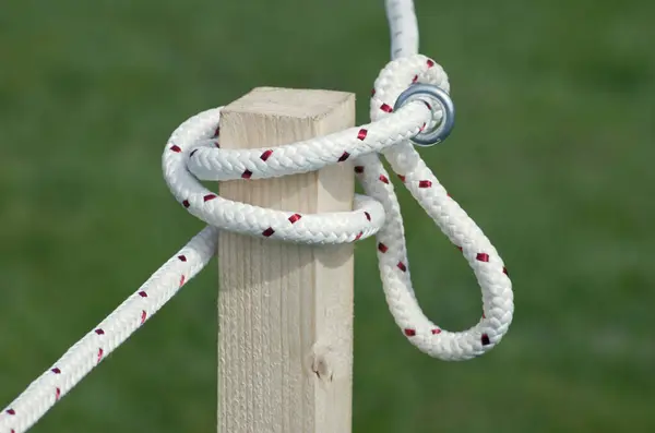 Knotted Rope On Wooden Post