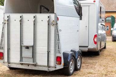 Horse box cargo trailer transport and horse transportation van at farm or ranch. Horsebox carriage lorry animal livestock tranport haulage.