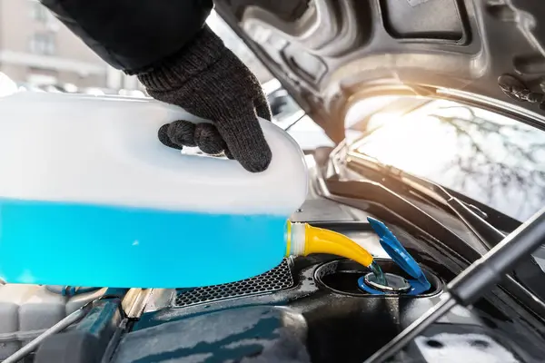 Close Detail Driver Mechanic Hand Gloves Pouring Blue Antifreeze Liquid — Stok fotoğraf