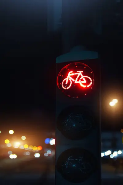 Bicycle stop red warning lamp sign on traffic light road highway driveway drive crossroad intersection evening dark time german city. Bike forward movement prohibited on semaphore signal city street.