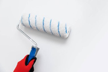 Close up of painter, roller painting. Painting, renovation walls