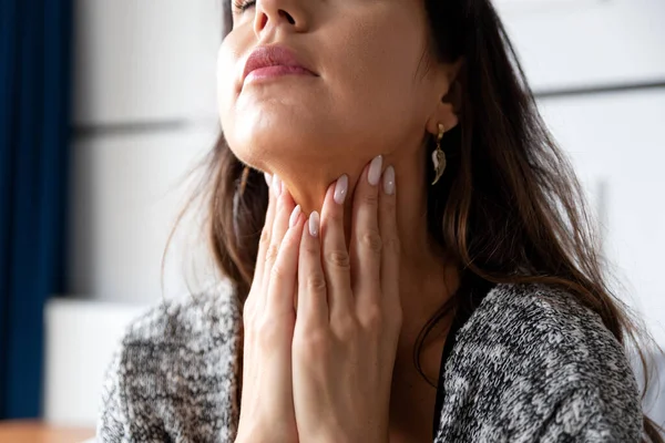 stock image Female checking thyroid gland by herself. Women thyroid gland control