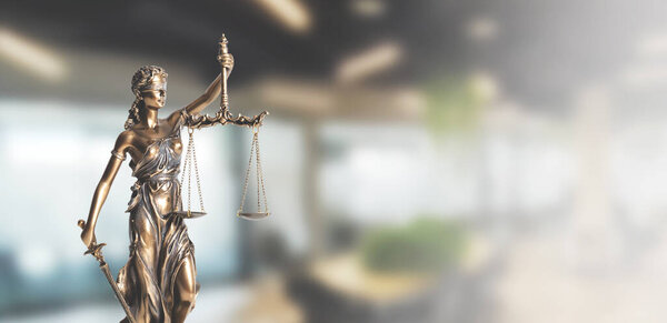 Blind justice symbol on a metallic statue. Law and justice concept, copy space