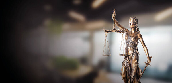 Blind justice symbol on a metallic statue. Law and justice concept, copy space