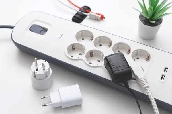 Electric power strip. Power plugs and a one multi socket electrical splitter with the surge protection.