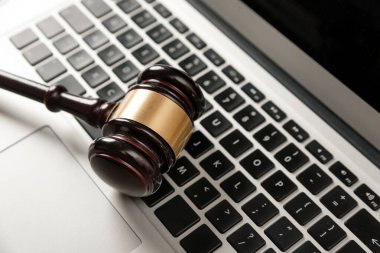 Cybercrime concept with gavel on laptop. Law and justice.