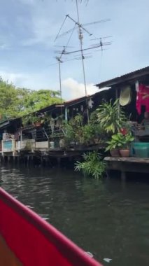 Riding a motor boat tour on Chao Phraya river in Bangkok, Thailand. 