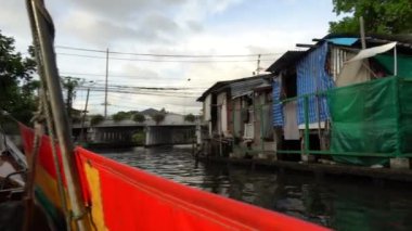 Riding a motor boat tour on Chao Phraya river in Bangkok, Thailand. 