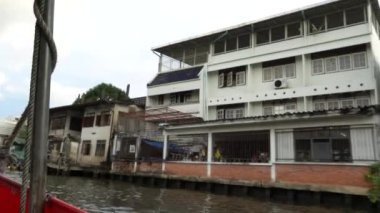 Riding a motor boat tour on Chao Phraya river in Bangkok, Thailand. 