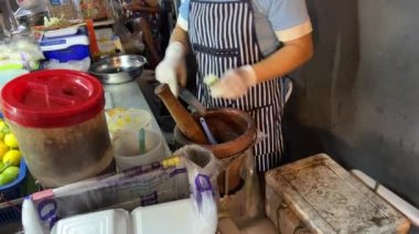 Street food vendor in Bangkok, Thailand making food