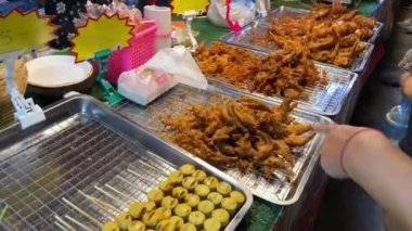 Street food vendor in Bangkok, Thailand making food