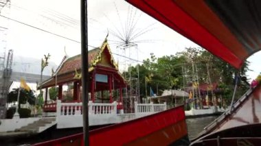 Riding a motor boat tour on Chao Phraya river in Bangkok, Thailand. 