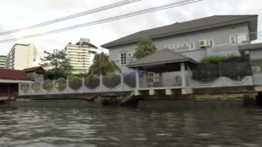 Riding a motor boat tour on Chao Phraya river in Bangkok, Thailand. 