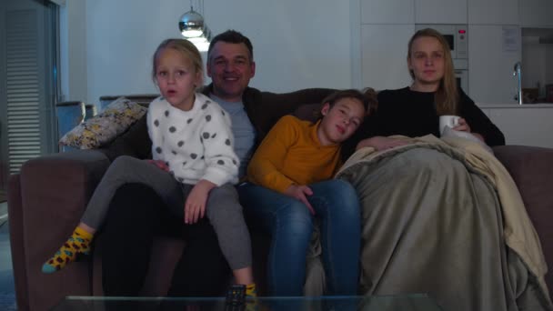 Family Consisting Father Mother Son Daughter Sitting Couch Watching Television — Wideo stockowe