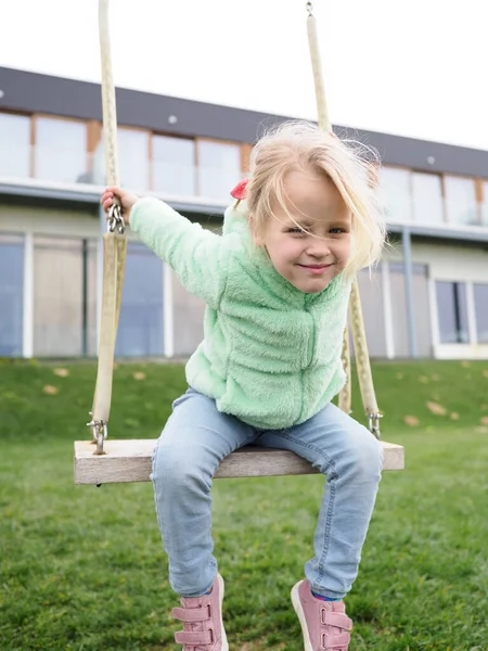 Cheerful Little Blonde Girl Years Old Having Fun Swings Playground — Stock Photo, Image