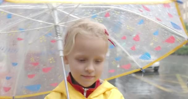 Year Old Blonde Girl Dressed Yellow Raincoat Walks Street Sheltering — Stock Video