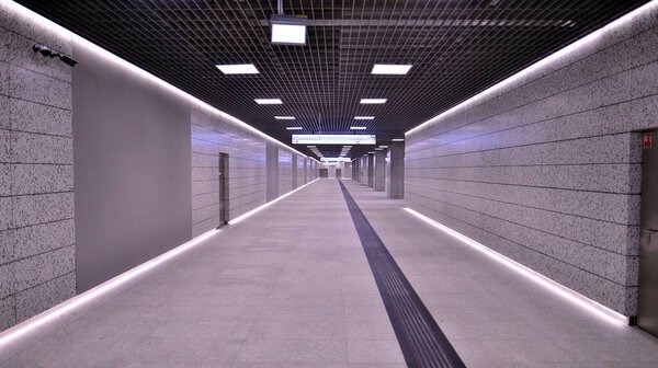 Warsaw, Poland. 5 November 2022. Modern interior design and lighting of metro Brodno station corridor. Second line of Warsaw Subway system.