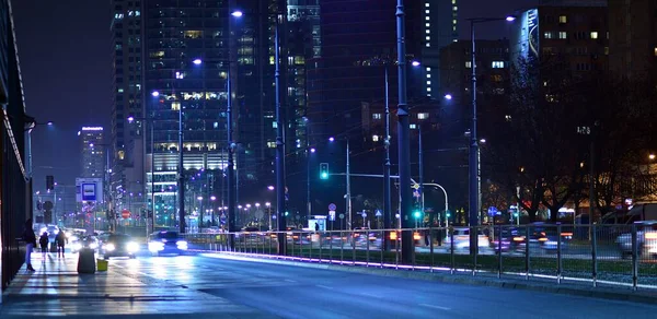 stock image Warsaw, Poland. 23 November 2022. Evening city life in the centre of Warsaw. Cars on street. City street lights at night.