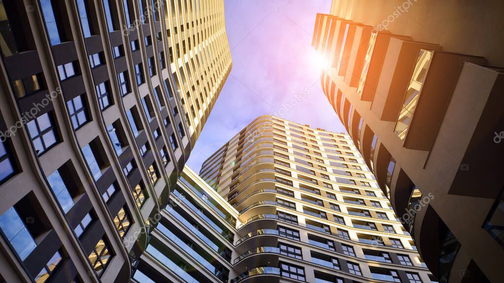 The narrow passage between modern residential buildings. Walls of high