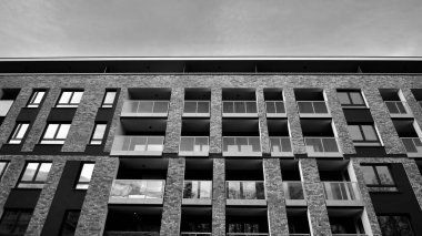 Apartments in residential complex. Housing structure at modern house.  Architecture for property investment. and architecture details. Urban abstract - windows of apartment building. Black and white.