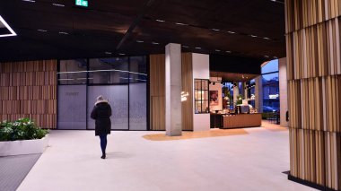 Warsaw, Poland. 19 January 2023. The interior of the Forest office building in the evening. Forest  is modern office space  for multiplying goods and ideas. Corporate needs a friendly office space. 