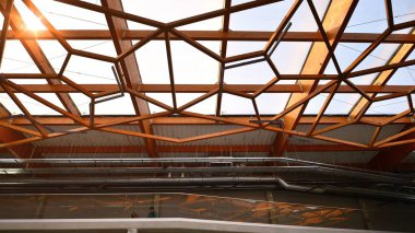 Wooden ceiling structure. Building with modern architectural design. Wooden modern roof.