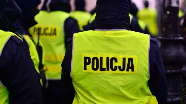 Polish Policemen Yellow Fluorescent Jackets — Zdjęcie stockowe