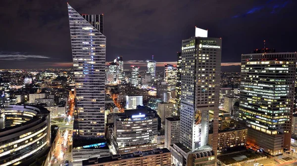 stock image Warsaw, Poland. 14 March 2023. Beautiful architecture of Warsaw city center with modern skyscrapers at night.